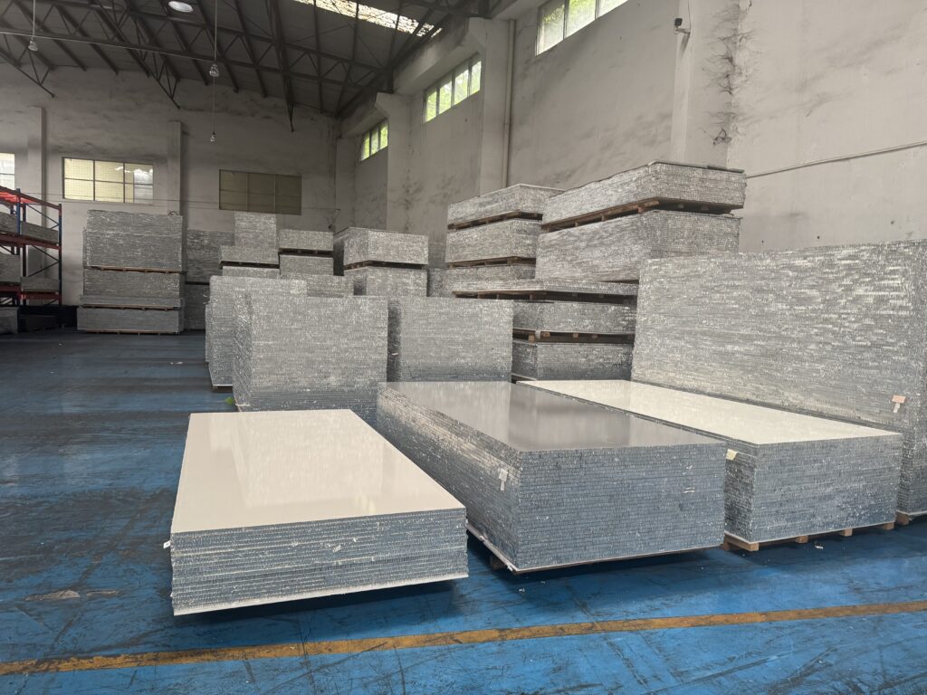 Aluminum honeycomb panels stacked in factory warehouse for lightweight composite panel production