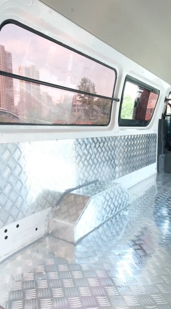 Aluminum honeycomb panels installed on cargo van interior walls and floors for lightweight vehicle applications