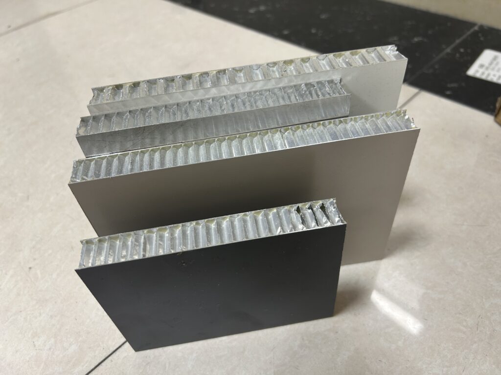 Aluminum honeycomb sandwich panel cross section showing aluminum skins and honeycomb core structure for truck bodies