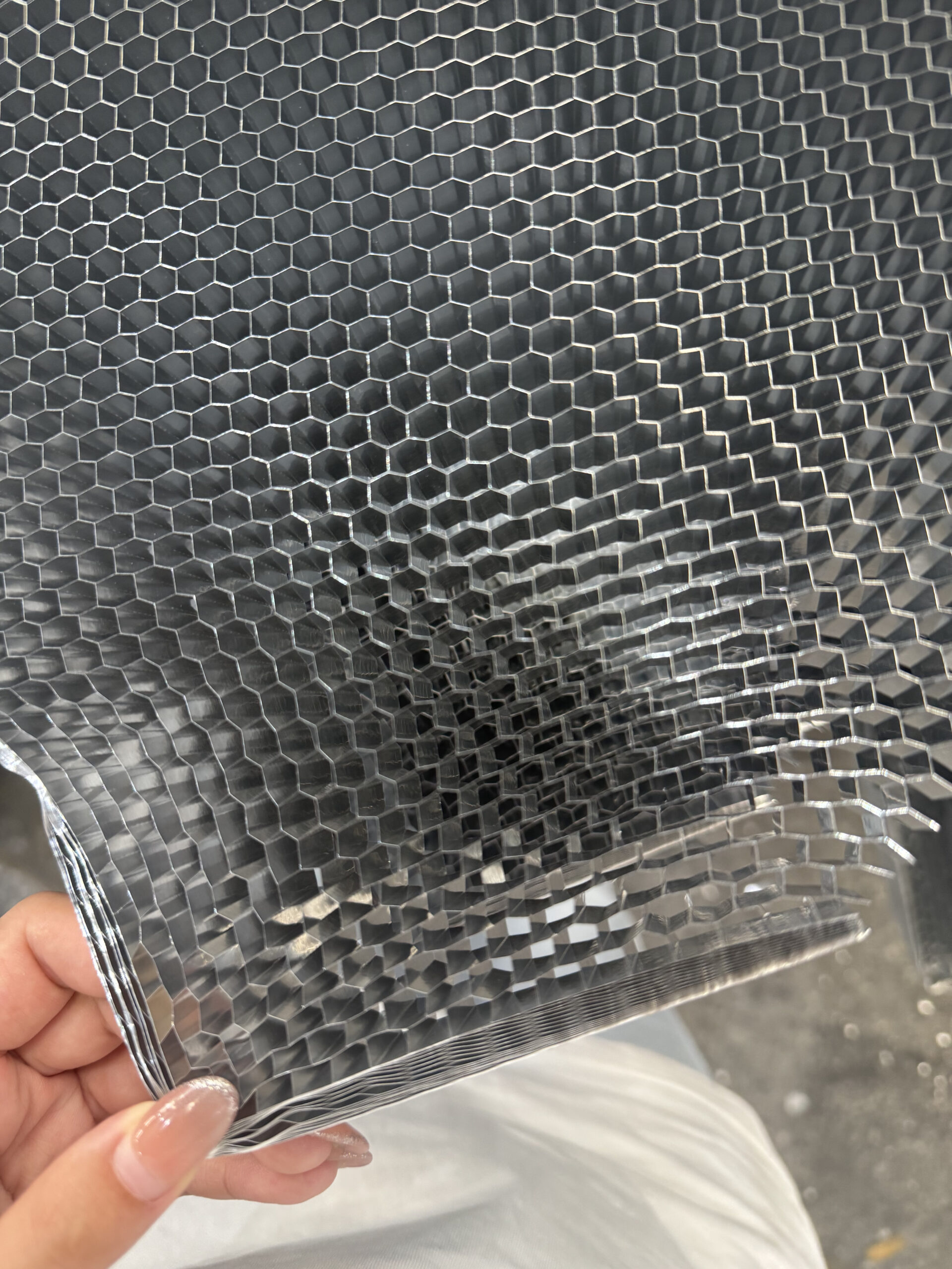 Close-up of aluminum honeycomb core showing its hexagonal cell structure