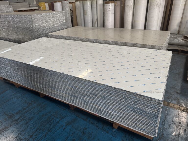 Aluminum honeycomb panels stacked in bulk at the factory