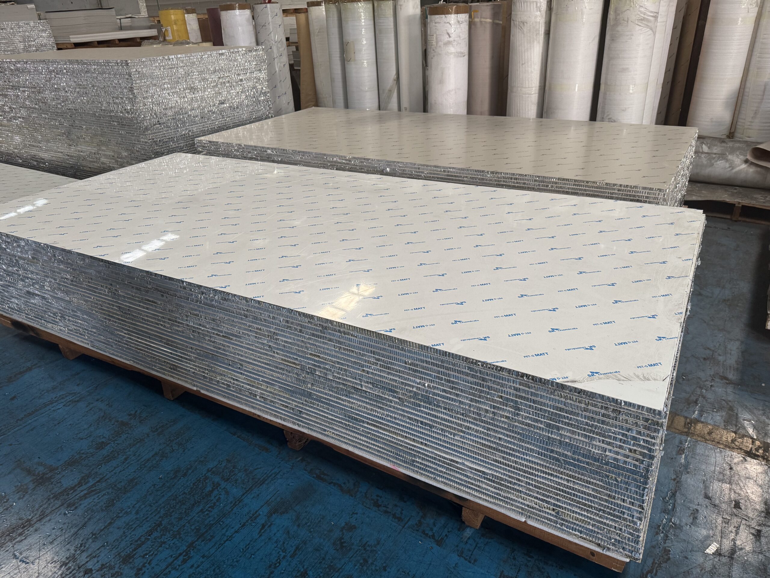Aluminum honeycomb panels stacked in bulk at the factory